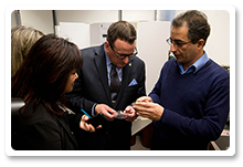 Photo: Dr. Saeid Soltanian, Research Associate (right), shows a flexible solar cell to Ms. Wai Young (Member of Parliament for Vancouver South) (left) and the Honourable Greg Rickford, Minister of State (Science and Technology) (centre).